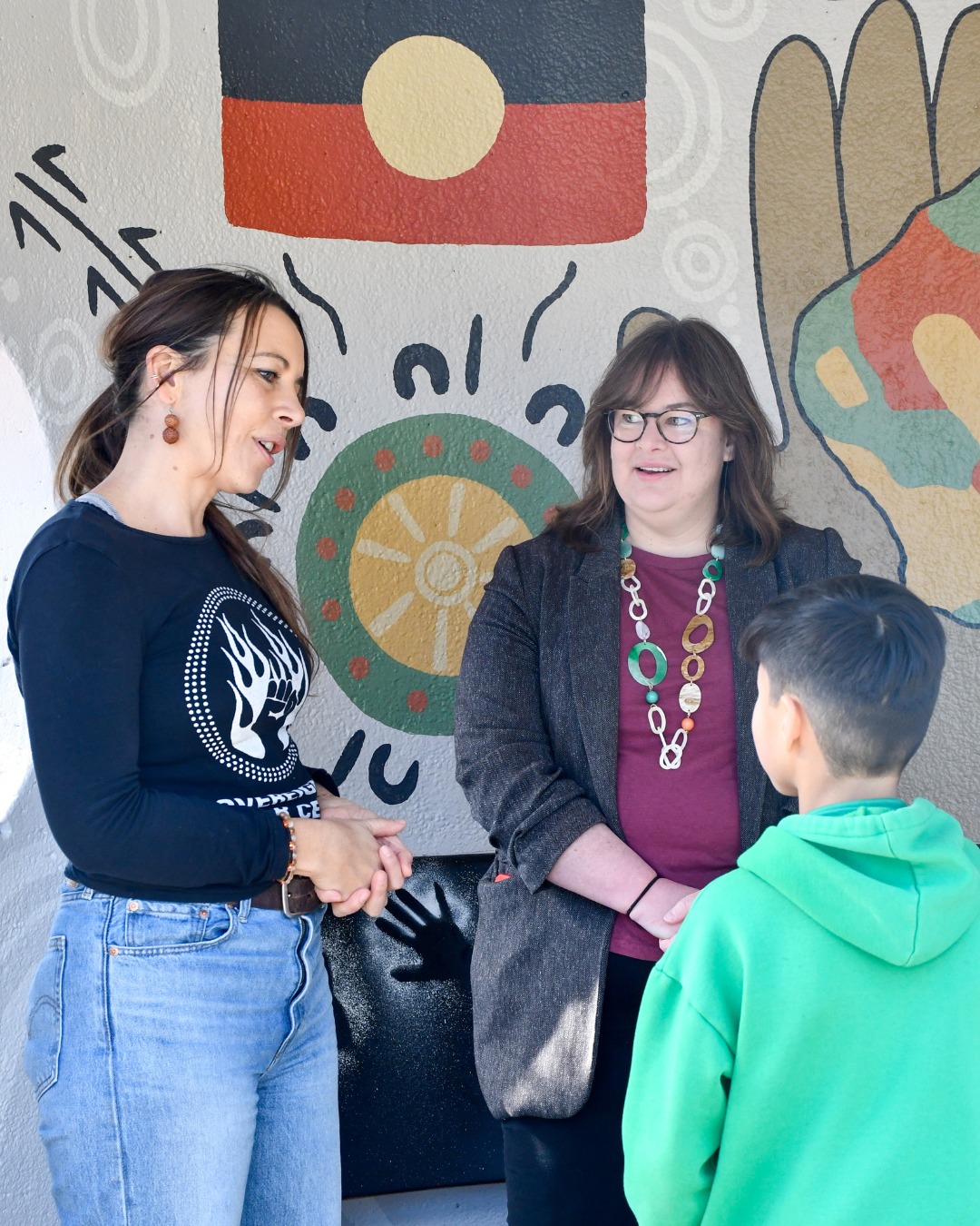 Year 6 artist Noah Yong puts Reconciliation in the picture at O’Connor bus stop Main Image